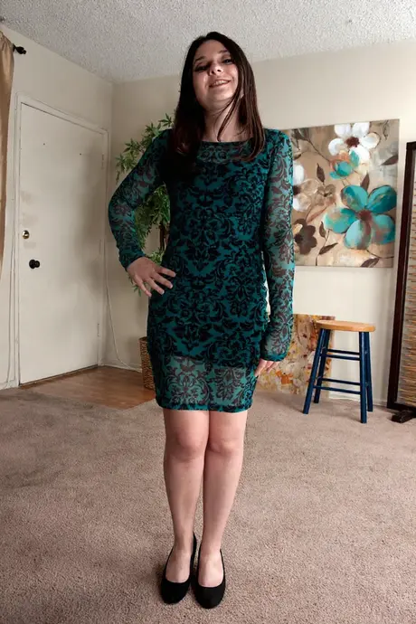 Amy Faye, a brunette in her twenties, strips down and opens her natural pussy with her fingers