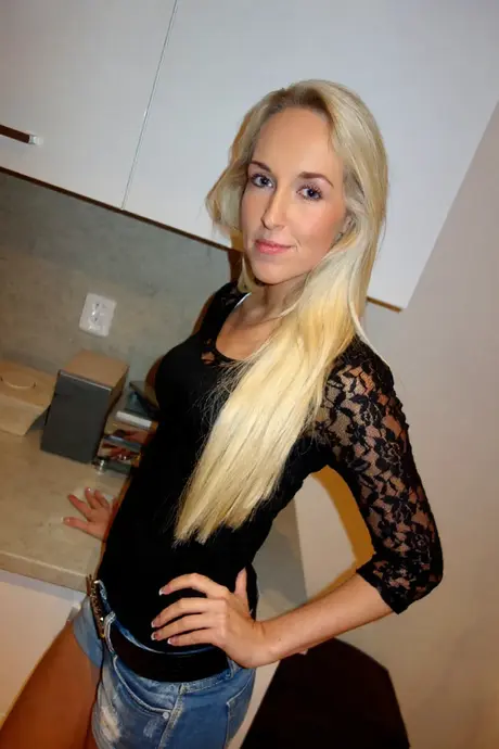 Angel Red, the small-breasted beauty, undresses and reveals her shaved vagina