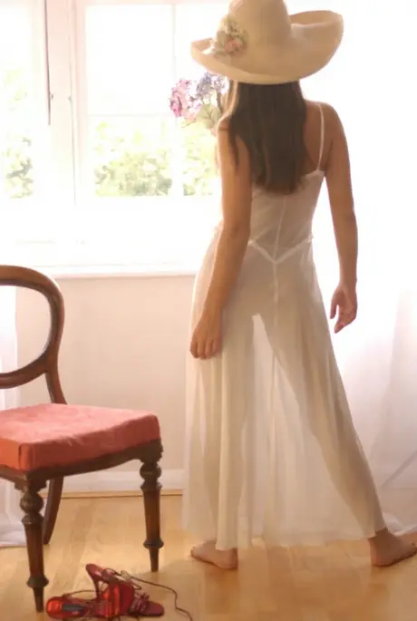 Long-haired solo model flaunts firm breasts and tight rear fully nude