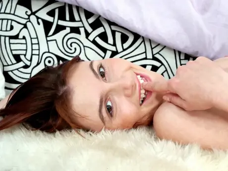 In socks on a bed, redhead Lina Valentine masturbates with sex toys