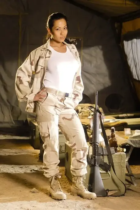 Asian military babe reveals her big tits and ass in a sexy uniform striptease