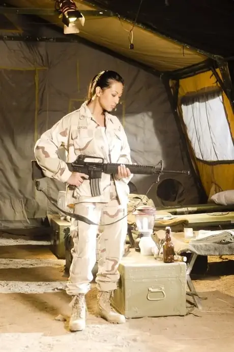Asian military babe reveals her big tits and ass in a sexy uniform striptease