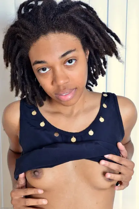 Beautiful ebony teen Olivia Green spreads her exotic hairy pussy wide in close-up