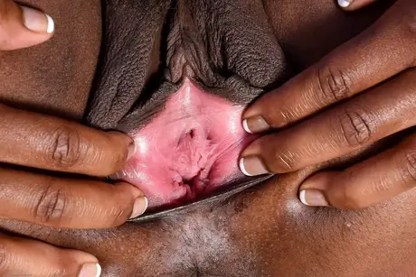 Charlie Rae, a Black woman, spreads her pussy lips to reveal the pink interior